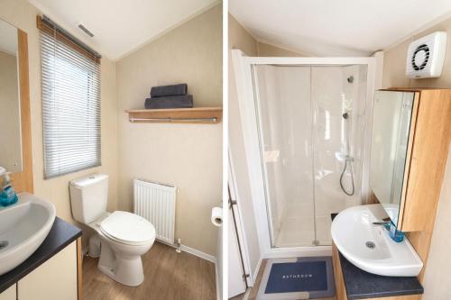a bathroom with a toilet sink and a shower at Cozy Family Caravan at Haven Kent Coast in Allhallows