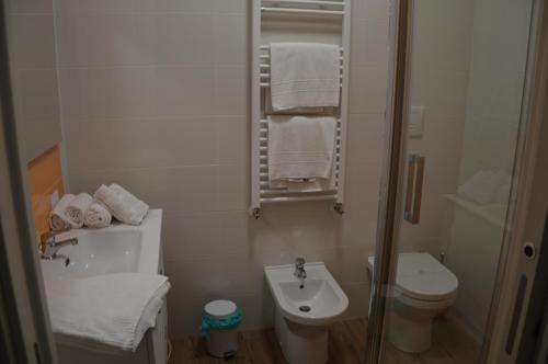 a small bathroom with a sink and a toilet at BLUE Airuno in Airuno