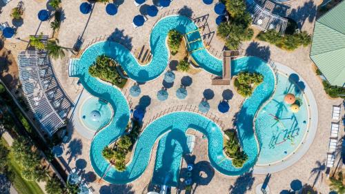 an aerial view of a swimming pool at a resort at Holiday Inn Club Vacations Cape Canaveral Beach Resort in Cape Canaveral
