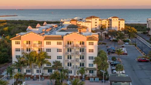 an aerial view of a building with the ocean in the background at Holiday Inn Club Vacations Cape Canaveral Beach Resort in Cape Canaveral