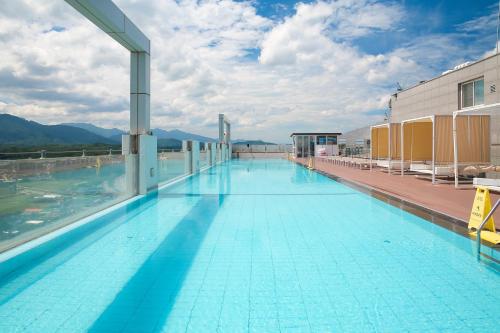 a large swimming pool on top of a building at Chestertons Naksan in Yangyang