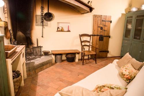 a living room with a couch and a wooden table at Agriturismo La Romagnana in Pistoia