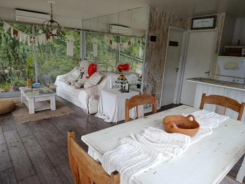 a living room with two teddy bears sitting on a couch at Casa Flotante Nenufar in Tigre