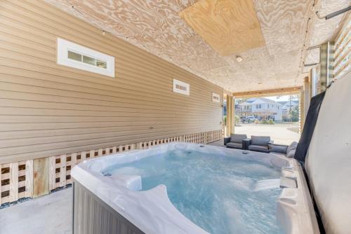 a jacuzzi tub sitting inside of a house at Ocean Dream in Kill Devil Hills