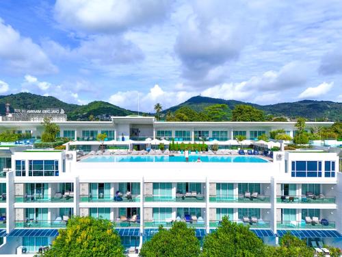 an aerial view of a hotel with a swimming pool at Chalong Marina Bay View Phuket in Rawai Beach