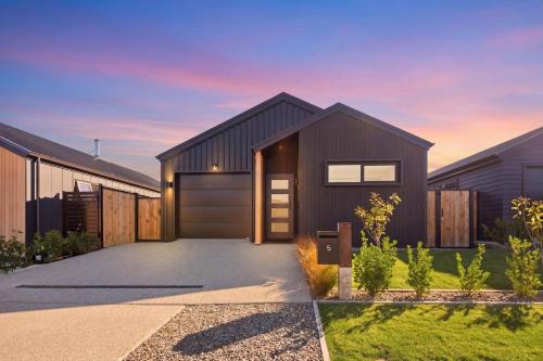a rendering of a house with a garage at The Reserve on Wooing Tree in Cromwell