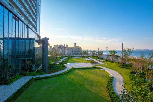 a view of a park next to a building at Yantai Marriott Hotel in Yantai