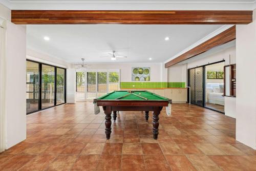an empty living room with a pool table at Spacious 4BR Waterfront Stay Pool Table AC in Newport