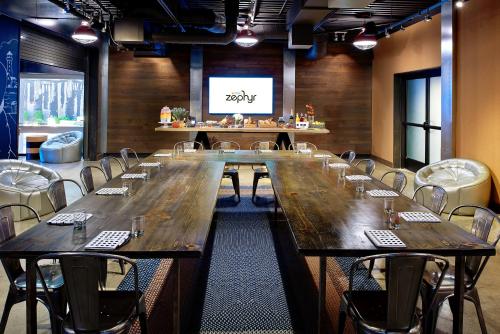 a large conference room with a large table and chairs at Hotel Zephyr San Francisco in San Francisco