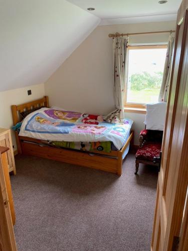 a small bedroom with a bed and a window at Grunkeys - PLEASE NOTE these are rooms in my home, not a separate property in Orkney