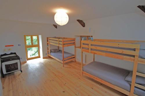 a room with two bunk beds and a stove at Mazeau nicot in Nedde