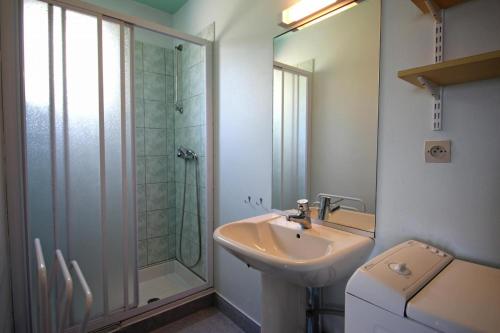 a bathroom with a sink and a shower at Gîte 87G5501 in Bujaleuf