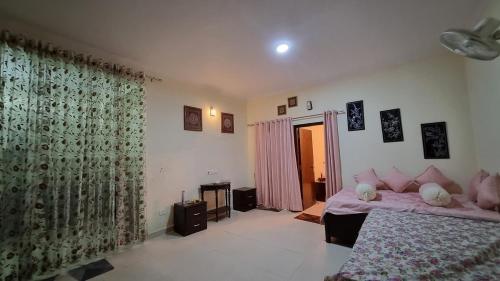 a bedroom with a bed and a fireplace in it at Pine Galaxy in Bhowāli