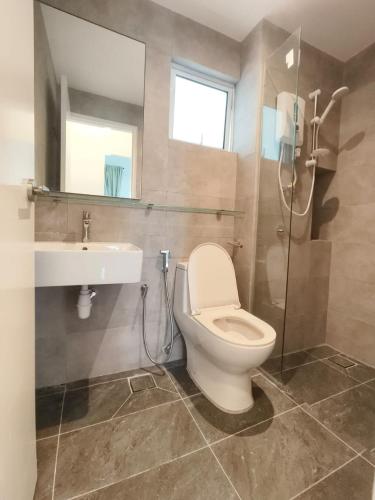 a bathroom with a toilet and a sink and a shower at Adilili Mesahill Premier Homestay, Nilai near KLIA USIM AEON Mall Mesa Mall Aurelius Hospital in Nilai