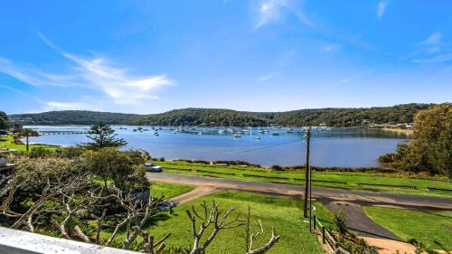 a view of a lake with boats in the water at 'Torcello - Waterfront on the Bay' by HolidayCo in Hardys Bay