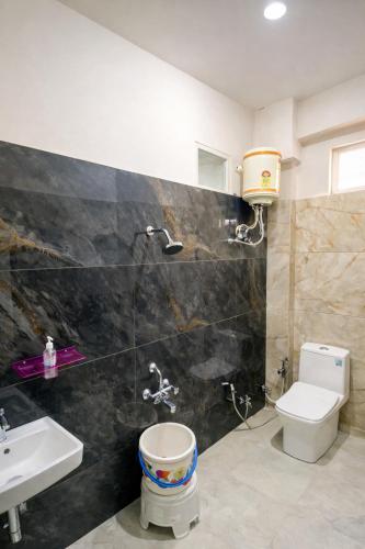a bathroom with a toilet and a sink at Hotel Tirupati Heights Ujjain # Near Railway Station # Top Rated Property in Ujjain