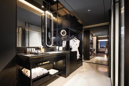 a bathroom with a sink and a mirror at SEYA Design Hotel - Chengdu Taikoo Li - Managed by SEYA GROUP in Chengdu