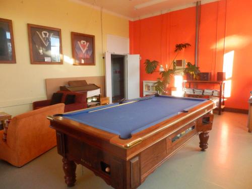 a living room with a pool table in it at Thomas's Catlins Lodge and Camp Ground in Owaka