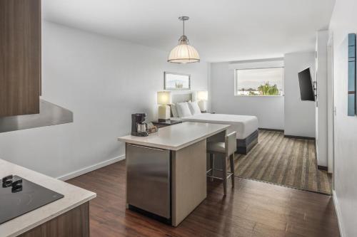 a hotel room with a bed and a desk at Hyatt House Irvine/John Wayne Airport in Irvine