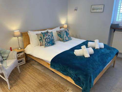 a bedroom with a bed with two teddy bears on it at Sunrise Apartment in Weymouth