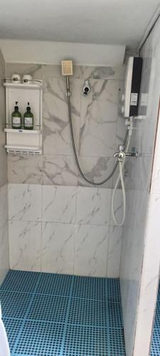 a shower in a bathroom with a marble shower at ThmorDa Resort in Koh Rong Sanloem