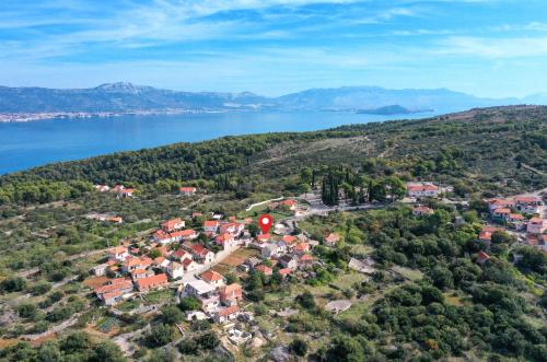 an aerial view of a small town next to a body of water at Islander house with pool in Trogir