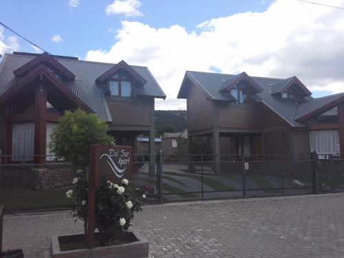 a house with a gate in front of it at Del Sur Apart in Esquel