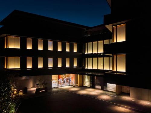 an external view of a building at night at HOTEL FORK & KNIFE Miyajima - Opening in Mar 28th 2026 in Miyajima
