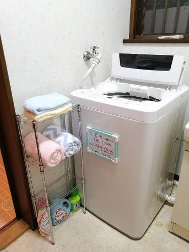 a washer and dryer sitting in a kitchen at Satoyama no Yado Kei-House - Vacation STAY 55796v in Shikokuchuo