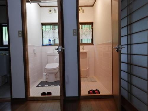 a bathroom with a toilet and a sink at Satoyama no Yado Kei-House - Vacation STAY 55796v in Shikokuchuo