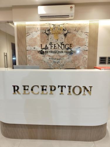 a sign for a reception at a library with the lerance reception sign at La Fenice Resort Madh Island in Mumbai