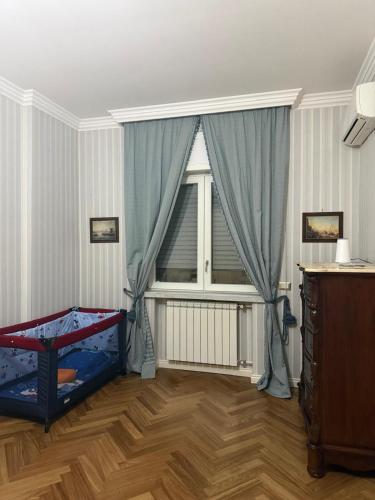 a room with a window and a bed in it at Casa Malù in Torre Annunziata