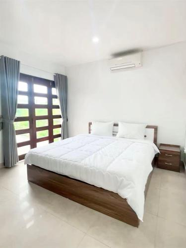 a bedroom with a large bed in a room at Khế Homestay Phố Cổ Ninh Bình in Ninh Binh