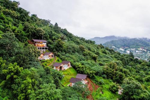 a house on the side of a mountain at Vianna Villas Chiangmai in Mae Rim