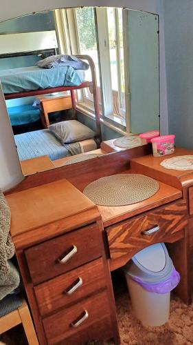 a room with a desk and bunk beds at Warradale Lodge and Mini Golf in Palgarup
