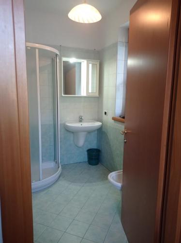 a bathroom with a sink and a toilet at Al Fiume in Arco