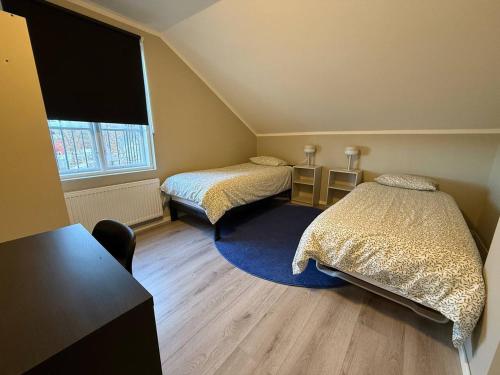 a small room with two beds and a window at Workers Stay - Housing for Workers Olofstorp Göteborg in Olofstorp
