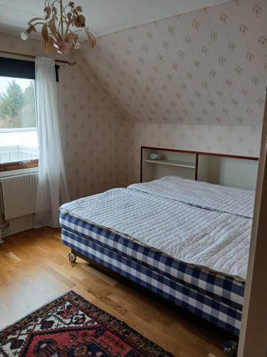 a bedroom with a bed in a room with a window at Workers Stay - Housing for Workers Volvo Torslanda in Gothenburg