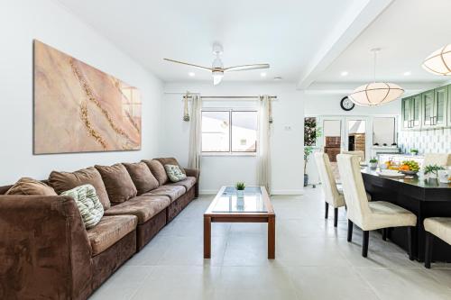 a living room with a couch and a table at Chilling In Lagos House Retreat by Algarve Golden Properties in Lagos