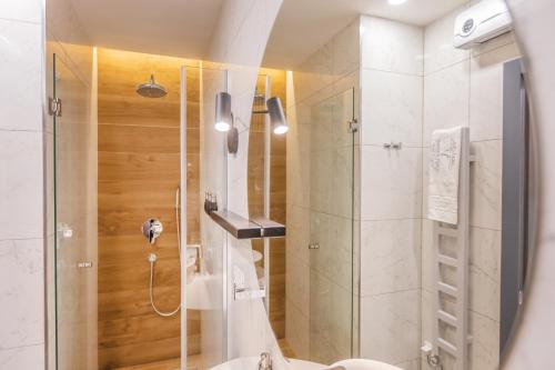 a bathroom with a shower and a toilet at V Luxury Apartment in Split