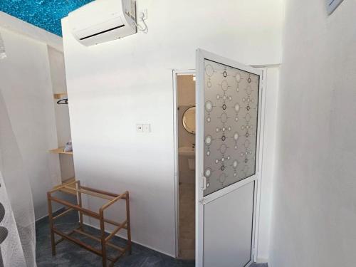 a door in a room with a chair next to it at Villa Sea View in Galle