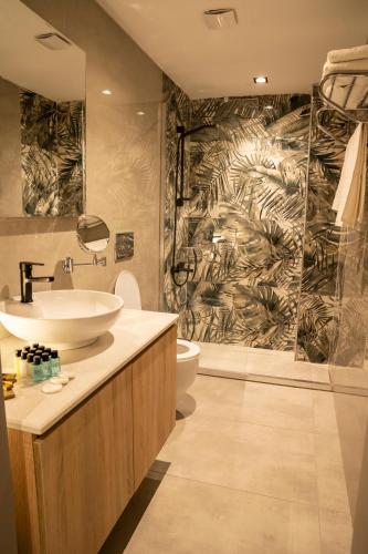 a bathroom with a sink and a toilet and a shower at ARCADIA of BODRUM in Bodrum City