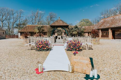 a wedding aisle in front of a gazebo at Kingston Country Courtyard in Kingston