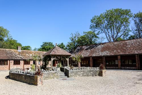 a brick building with a gazebo in a courtyard at Kingston Country Courtyard in Kingston