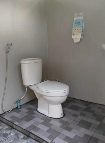 a bathroom with a white toilet in a room at Doi Inthanon Waterfall Garden in Ban Sop Mae Klang