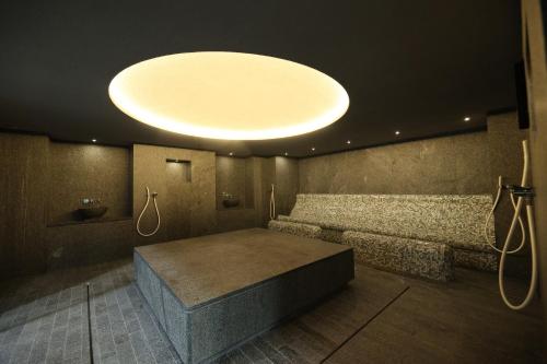 a room with a large light on the ceiling at Terme BANJA LUKA in Banja Luka