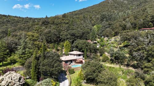 an aerial view of a house in the mountains at Les Brugas de Camias in Saint-André-de-Majencoules