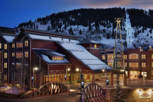 a large building with snow on the roof at Marriott Summit Watch 1BD in Park City