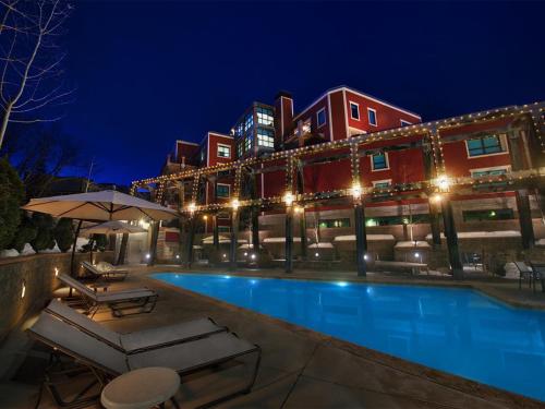 a hotel with a swimming pool at night at Marriott Summit Watch 1BD in Park City