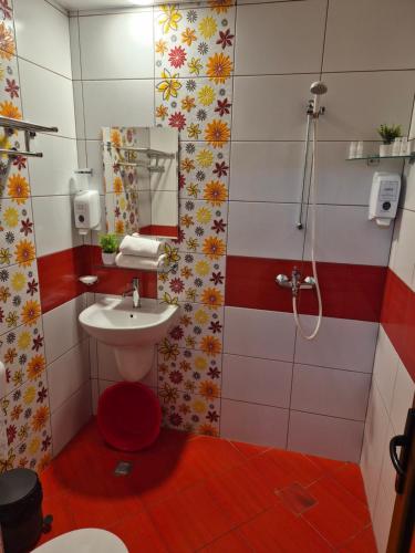 a bathroom with a sink and a shower at Guest Rooms Skalite in Sozopol